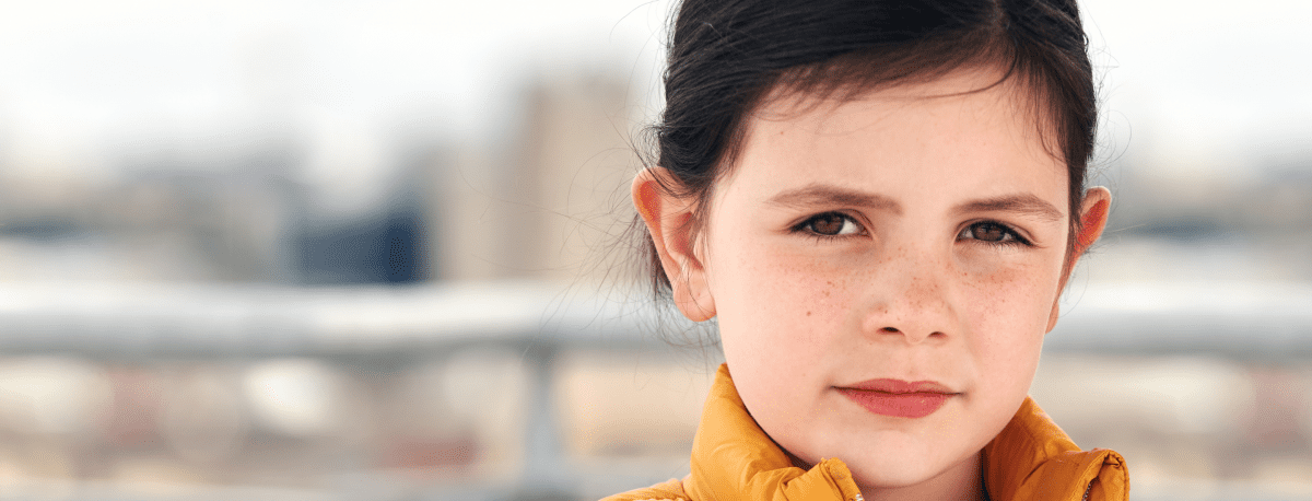 young female child looking at the camera.